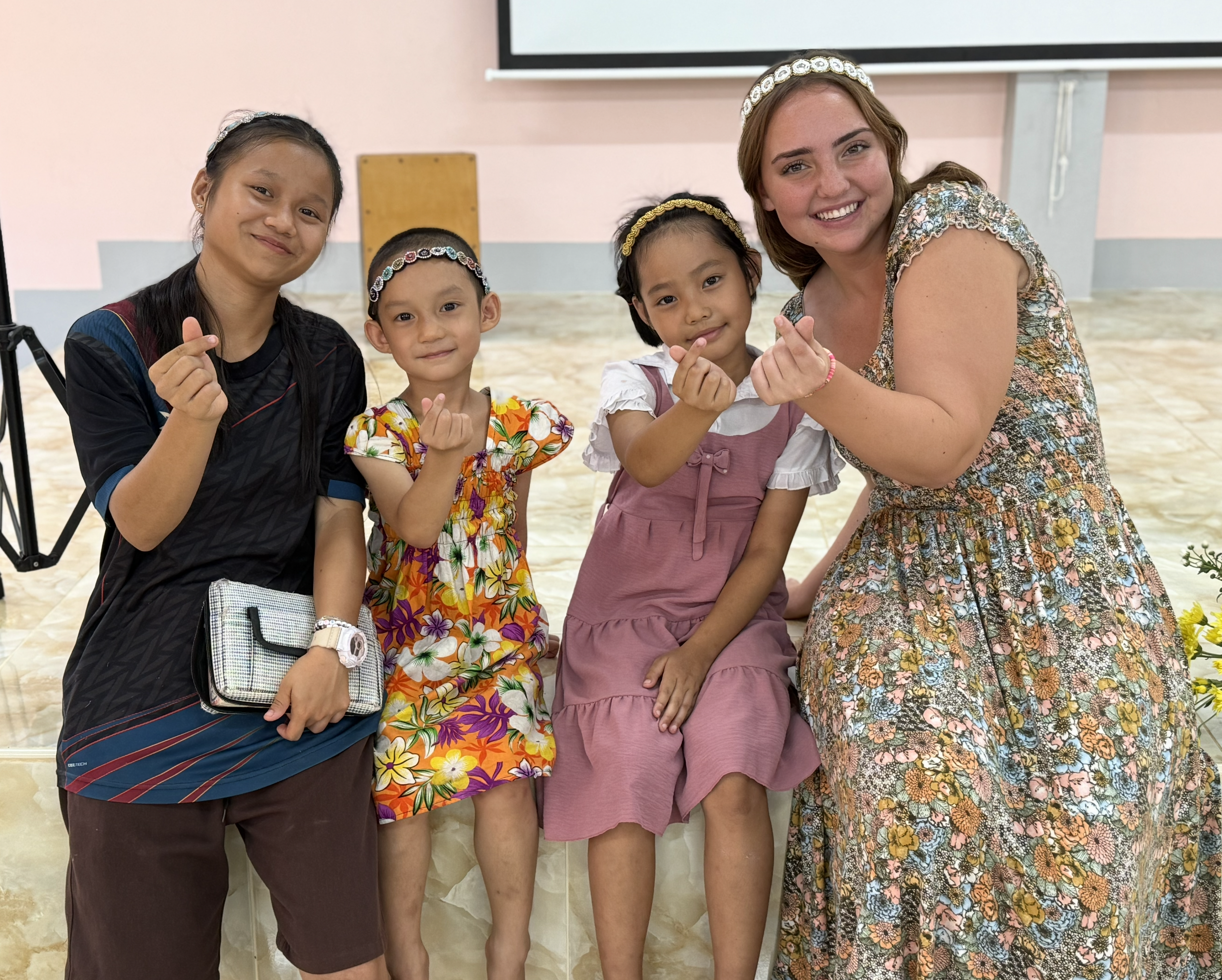 Joell making friends with the girls at Faith House